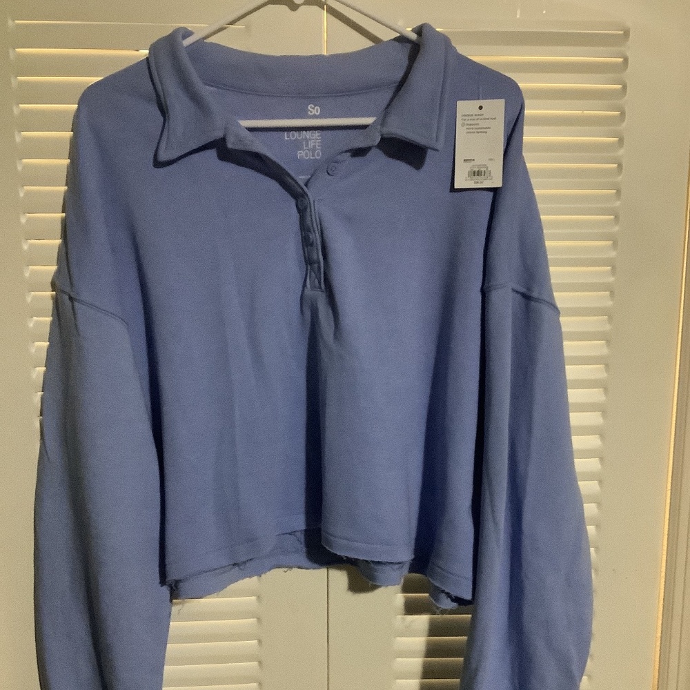Brand new with tags, cropped women’s polo sweatshirt, size L, sky blue